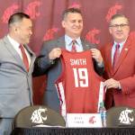 Washington State new head mens basketball coach Kyle Smith, center, poses with athletic director Patrick Chun, left, and school President Kirk Schulz during a news conference on Monday, April 1, 2019, in Pullman, Wash. (Geoff Crimmins/Moscow-Pullman Daily News via AP)