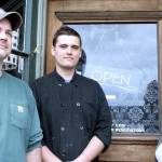 From left, Bill Bonyun, Graham Welch and Kristan McCary were in the final stages of preparations Friday before the reopening of the Ajax Cafe, 21 N. Water St. in Port Hadlock. (Brian McLean/Peninsula Daily News)