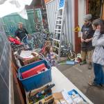 Jonathan Arp, ReCyclery shop manager, talks with Lisa Flores, right, about getting a bike for her four-year-old grandaughter Aria Winterburn. (Jesse Major/Peninsula Daily News)