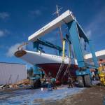 The schooner Adventuress waits in a 300-ton lift before being put in the water Friday. (Jesse Major/Peninsula Daily NEws)