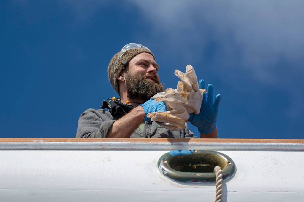 Crews prepare the schooner Adventuress before it is taken to the water Friday. (Jesse Major/Peninsula Daily News)