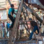 Crews work on the schooner Adventuress before it is taken to the water Friday. (Jesse Major/Peninsula Daily News)