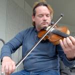 PHOTO: Port Townsend busker fiddles for funds in Sequim
