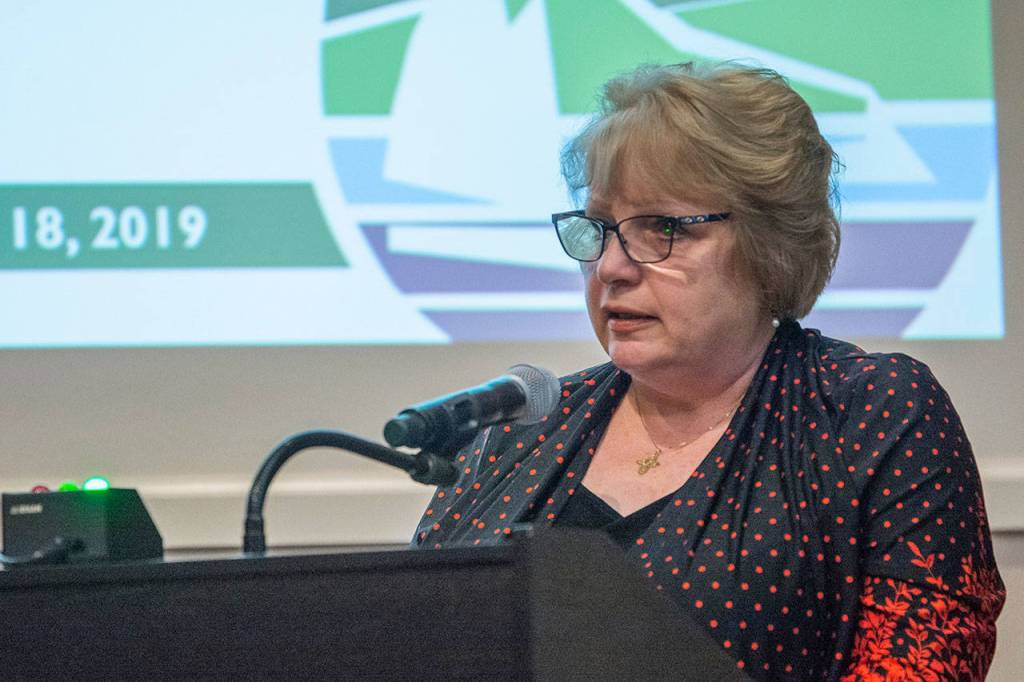 Former Port Angeles Mayor Karen Rogers tells the Port Angeles Parks, Recreation & Beautification Commission on Thursday night that community members have raised $7,000 to go toward putting a fence around the Liberty Bell at Veterans Memorial Park. (Jesse Major/Peninsula Daily News)