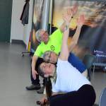 Instructor Rae Kala, foreground, guides participants into a stretch during her weekly Dance for Parkinsons class in Port Townsend. (Diane Urbani de la Paz/for Peninsula Daily News)