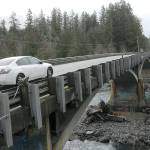 A car makes its way across the U.S. Highway 101 bridge over the Elwha River west of Port Angeles in Feburary. (Keith Thorpe/Peninsula Daily News)