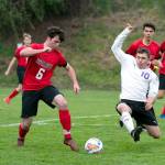 Port Townsends Zachary Dempsey, left, and Sequims Mathys Tanche vie for control in a game at Memorial Field in Port Townsend on Tuesday.                                Steve Mullensky/for Peninsula Daily News