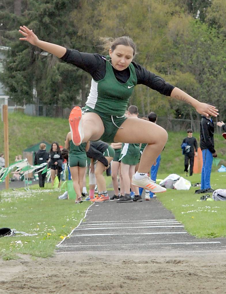 Keith Thorpe/Peninsula Daily News Jazmine Ruiz-Darling of Port Angeles competes in the long jump on Thursday in Port Angeles.