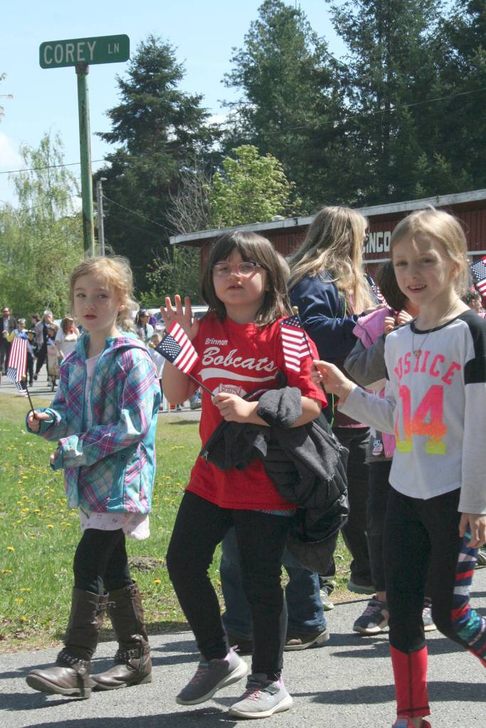 Brinnon Elementary students pass Corey Street on Schoolhouse Road to get to Brinnon Lane during the Loyalty Day Parade, which is about 5 1/2 blocks long. (Brian McLean/Peninsula Daily News)