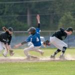 Steve Mullensky/for Peninsula Daily News Chimacums Clayton Smith beats the throw to Klahowyas Logan Prater and slides safely into second on a steal during a game in Chimacum on Friday.