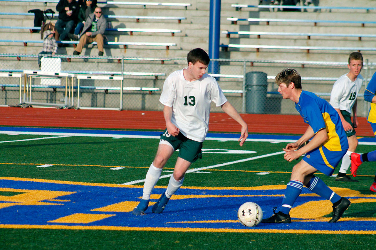 Stuart Methner, left, battles Bremertons Joash Smith for a loose ball in the Roughriders 2-1 loss to the Knights. (Mark Krulish/Kitsap News Group)