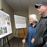John Hayduk of Port Angeles, right, and his mother, Janet Hayduk, a long-time crossing guard at Jefferson School, look over proposals to resurface and reconfigure portions of Lauridsen Boulevard during a public open house on Wednesday at the Port Angeles Public Library. City planners listened to public suggestions and concerns about the project, which could include new turn lanes, street markings and improved pedestrian crosswalks. (Keith Thorpe/Peninsula Daily News)