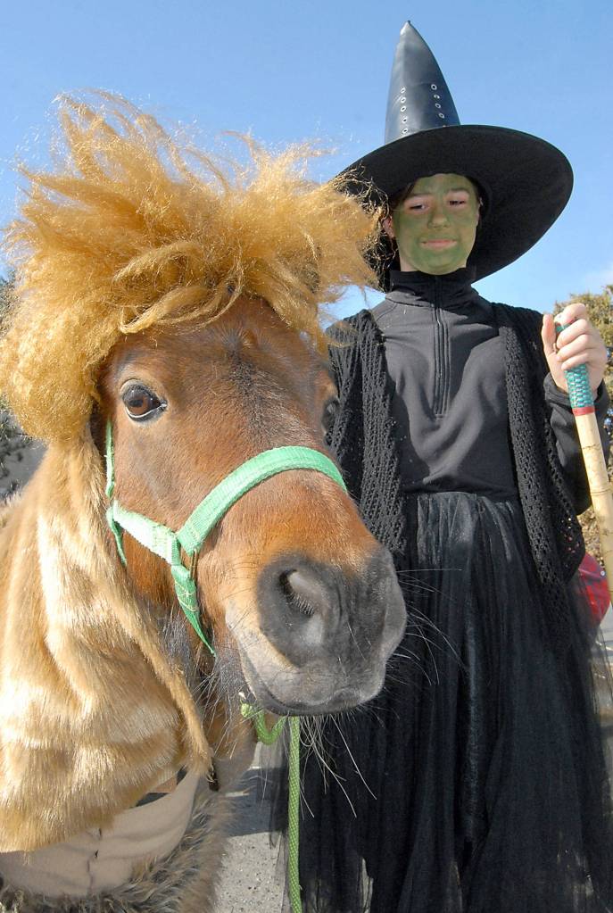 Olivia West, 12, of Sequim, along with her pony, Chrome, wait for the start of the Kiddie Parade on Saturday. The pair dressed up as characters from The Wizard of Oz to go along with the Irrigation Festivals 2019 theme, Theres No Place Like Home. (Keith Thorpe/Peninsula Daily News)
