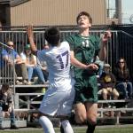 Keith Thorpe/Peninsula Daily News Gabe Long of Port Angeles, right, vies for a header with Fosters James Bond on Saturday in Port Angeles.