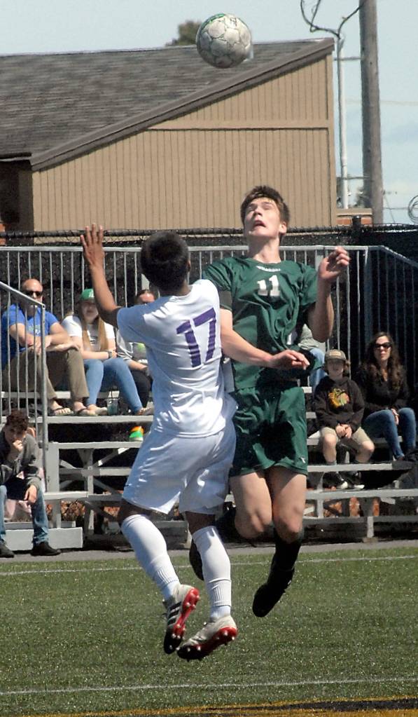 Keith Thorpe/Peninsula Daily News Gabe Long of Port Angeles, right, vies for a header with Fosters James Bond on Saturday in Port Angeles.