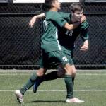 Keith Thorpe/Peninsula Daily News Port Angeles Stuart Methner, right, is congratulated by teammate Luis Galvan after Methner scored a goal against Foster in the first half at Peninsula College in Port Angeles.