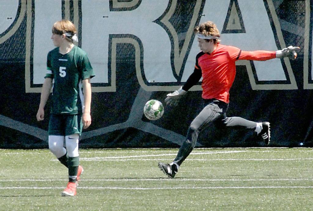 Keith Thorpe/Peninsula Daily News Port Angeles goalkeeper Anton Kathol, right, sends the ball downfield as teammate Hollund Bailey keeps watch against Foster on Saturday.