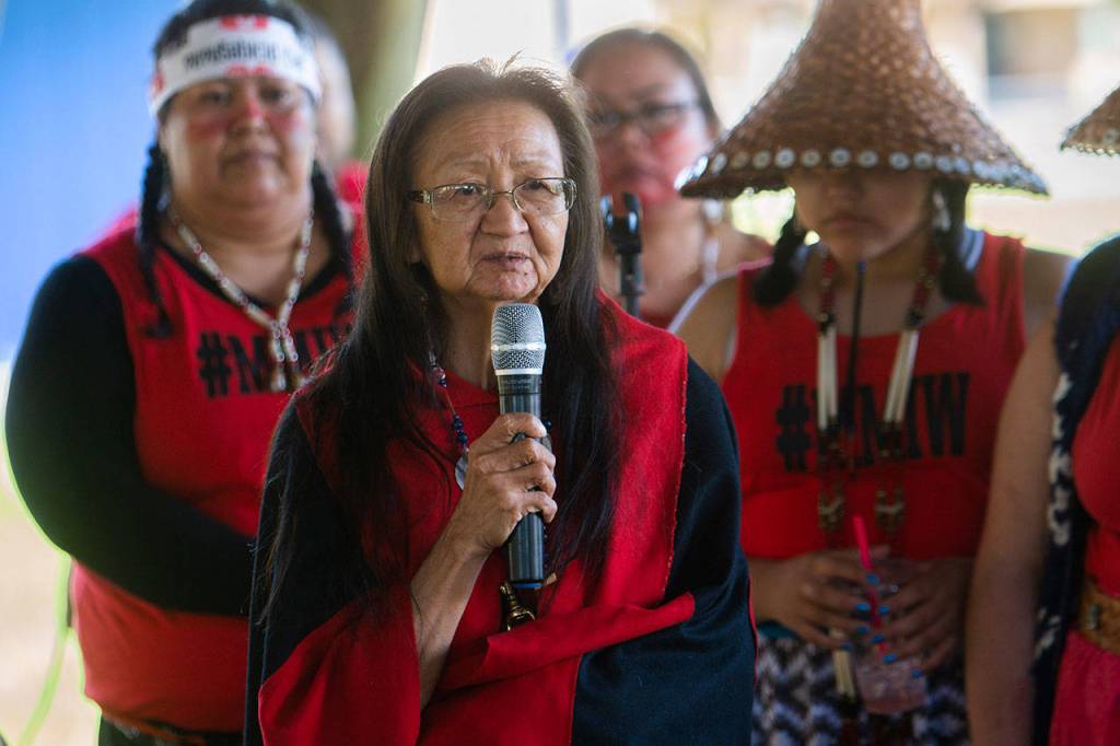 Vivian Lee, a Hoh Tribal Elder and storyteller, tells the 200 people who gathered for the Missing and Murdered Indigenous Women march in Forks on Sunday of the violence she has experienced. (Jesse Major/Peninsula Daily News)