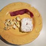 Half of a fresh, homemade bagel with scrambled eggs and turkey bacon makes for a delicious breakfast. (Emily Hanson/Peninsula Daily News)