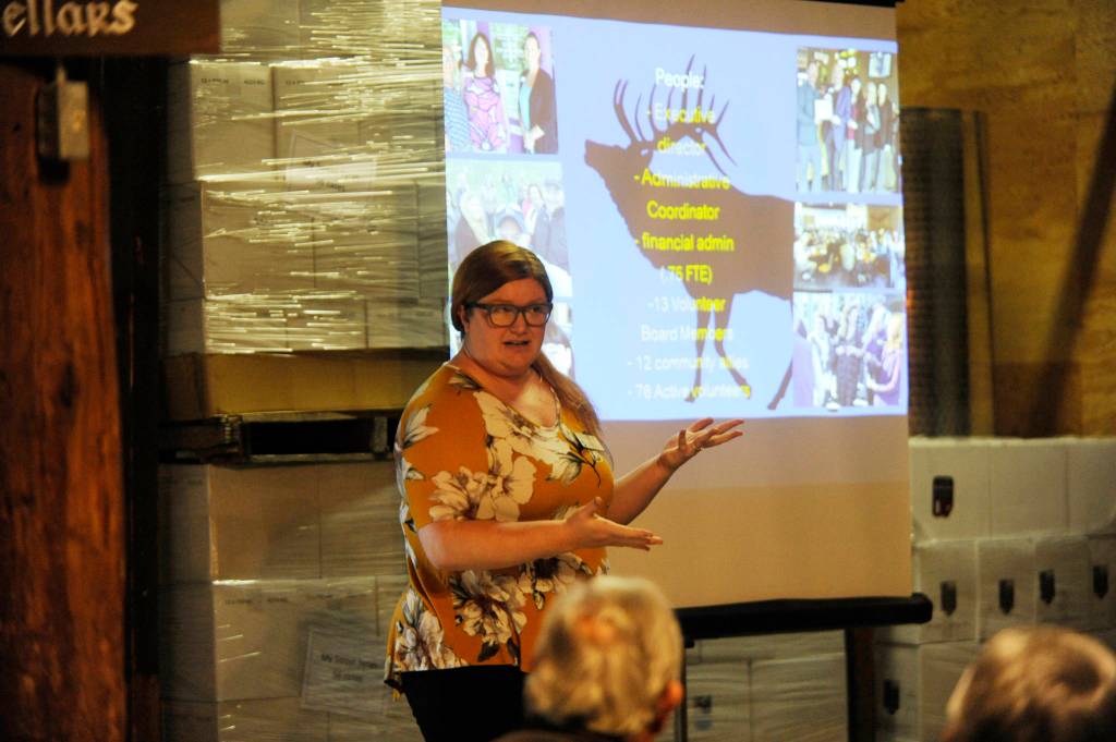 Anji Scalf, executive director of the Sequim-Dungeness Valley Chamber of Commerce, talks with Sequim and Port Angeles chamber members on Monday. (Michael Dashiell/Olympic Peninsula News Group)