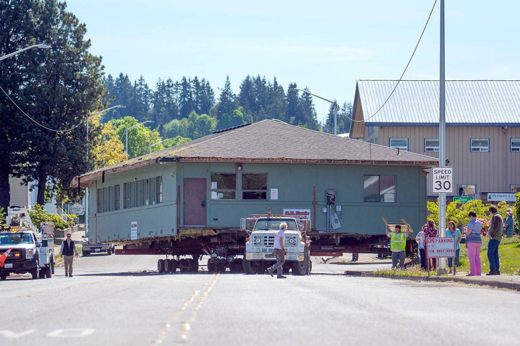 Peninsula Behavioral Healths Horizon Center turns onto Eighth Street as it moves to its new home at 223 E. Eighth Street on Thursday. (Jesse Major/Peninsula Daily News)