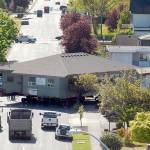 The Horizon Center building is maneuvered around the corner at the intersection of Fifth and Chase streets in Port Angeles on Thursday. (Keith Thorpe/Peninsula Daily News)