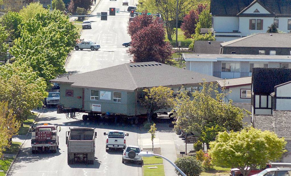 The Horizon Center building is maneuvered around the corner at the intersection of Fifth and Chase streets in Port Angeles on Thursday. (Keith Thorpe/Peninsula Daily News)