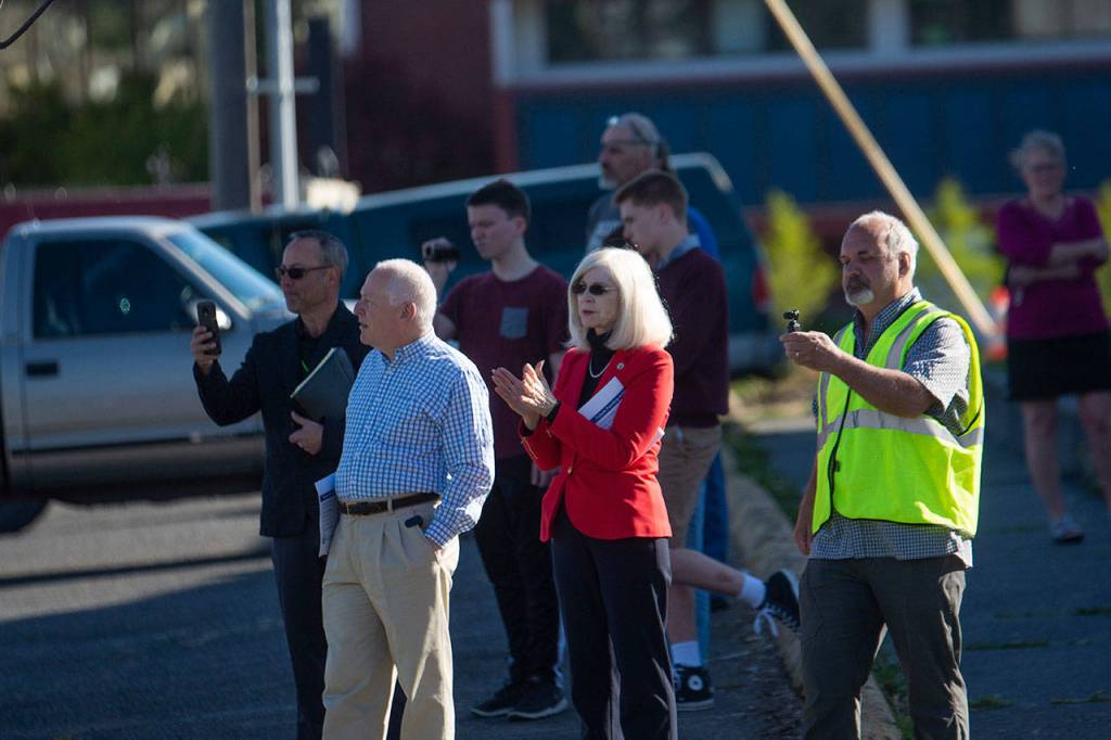 Steve Burke, director of William Shore Memorial Pool, right, watches on as the Horizon Center moves to make space for the pools upcoming expansion. (Jesse Major/Peninsula Daily News)