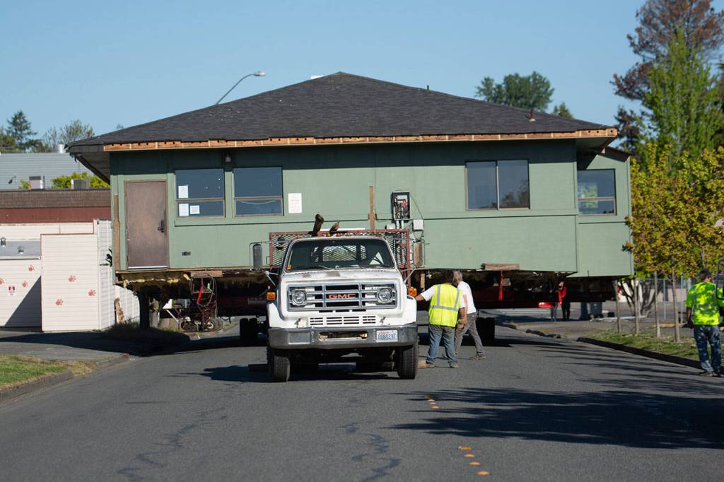 The Horizon Center moves down East Fifth Street on Thursday. (Jesse Major/Peninsula Daily News)