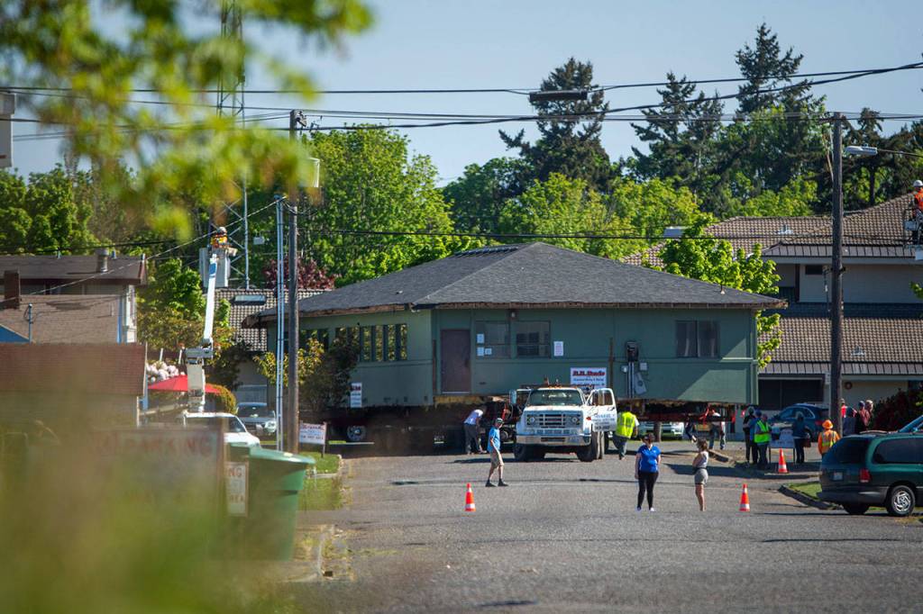 The Horizon Center turns from East Fith Street onto Chase Street as it moves to its new home at 223 E. Eighth Street on Thursday. (Jesse Major/Peninsula Daily News)