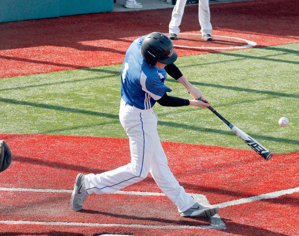 Mark Krulish/Kitsap News Group Chimacums Issac Purser connects for one of his two hits against Klahowya.