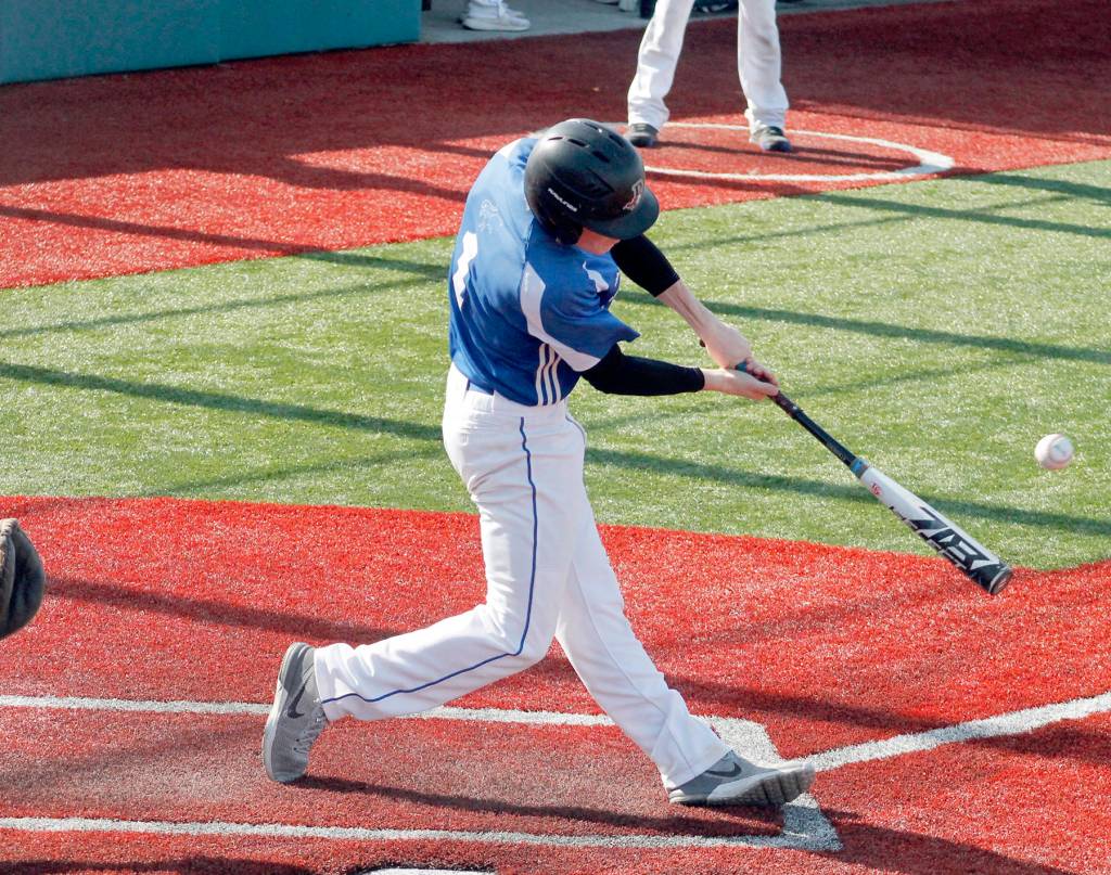 Mark Krulish/Kitsap News Group Chimacums Issac Purser connects for one of his two hits against Klahowya.
