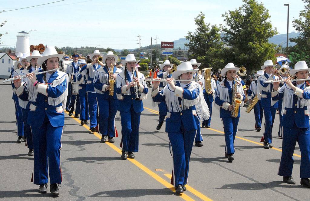 Members of the Chinacum High School marching band perform as they march down Washington Street during Saturdays Irrigation Festival Grand Parade in Sequim. (Keith Thorpe/Peninsula Daily News)
