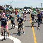 Youth unicyclists from Hamilton School in Port Angeles entertain parade-goers on Saturday. (Keith Thorpe/Peninsula Daily News)