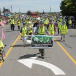 Members of the Clallam County Community Emergency Response Team wear yellow safety vests as they ply the parade route. (Keith Thorpe/Peninsula Daily News)