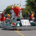 A float representing the Marysville Strawberry Festival rolls down the parade route on Saturday. (Keith Thorpe/Peninsula Daily News)