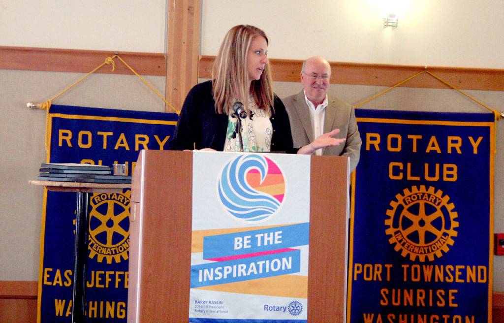 Kelly Liske thanks luncheon attendees Tuesday for her nomination as a Heart of Service award winner. Steve Perry, general manager for the Peninsula Daily News, served as the master of ceremonies for the event at the Northwest Maritime Center. (Brian McLean/Peninsula Daily News)