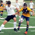<strong>Lonnie Archibald</strong>/Peninsula Daily News                                Forks Hugo Sandoval, right, controls the ball against Klahowyas Logan Brunson during Tuesdays Class 1A state soccer tournament game at Spartan Stadium.