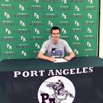 Port Angeles Liam Clark signed a letter of intent Thursday to play basketball at Clark College in Vancouver. Clark also intends to compete in track and field for the Penguins.