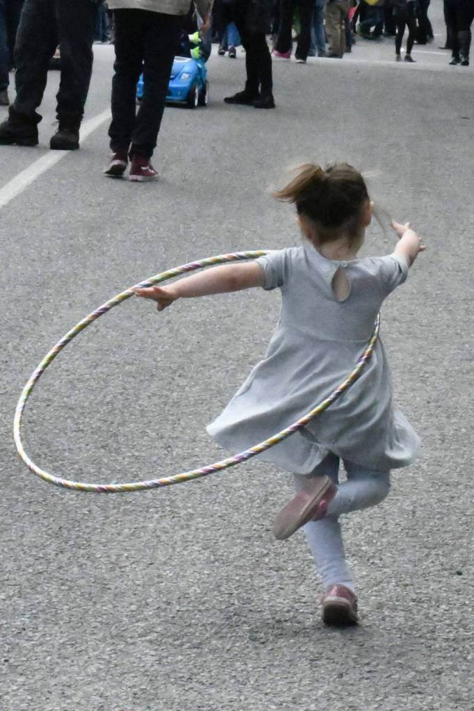 Port Townsends Hazel Oley, almost 3 years old, practices her hula hoop skills at the start of the Rhody Kiddies Parade on Friday. (Jeannie McMacken/Peninsula Daily News)