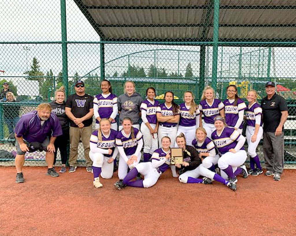 The Sequim softball team celebrates its WCD III 2A championship Saturday at Lacey. The Wolves begin play at the state 2A tournament Friday.
