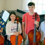 The Port Townsend musicians appearing in the annual concert to benefit Uganda orphans include, from left, Elliott Kitchcart, 13; Maddie Geelan, 12; Will Hiegel, 14; and Soare Johnston, 11. (Diane Urbani de la Paz/for Peninsula Daily News)