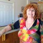 Jeanette Gossard is shown in the Bees Knees Boutique in Port Angeles. (Denise Buchner/Peninsula Daily News)