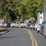 Traffic waits on U.S. Highway 101 around Lake Crescent as crews continue working on the road March 19, 2019. (Jesse Major/Peninsula Daily News)