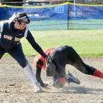 Lonnie Archibald/for Peninsula Daily News Forks shortstop Julia Lausche applies the tag to a baserunner during a game earlier this season.