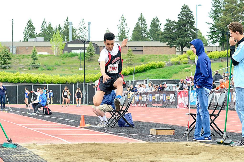 Neah Bays Sean Bitegeko competes in the long jump in Cheney at the 1B state track and field meet. Bitegeko finished 12th with a jump of 37 feet, 5 3/4 inches. (Casey Bruner)