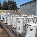 Electric power transformers sit in the Port Angeles public utility storage yard on Lauridsen Boulevard near the site of a proposed City Light building for electrical equipment. (Keith Thorpe/Peninsula Daily News)