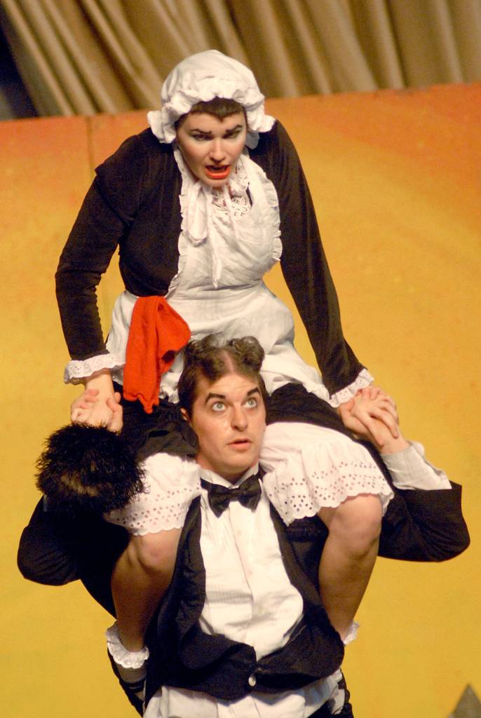 Amica Hunter, top, and Dave Cantor of the vaudeville duo A Little Bit Off give a slapstick performance on Saturday on the Juan de Fuca Festival Main Stage.