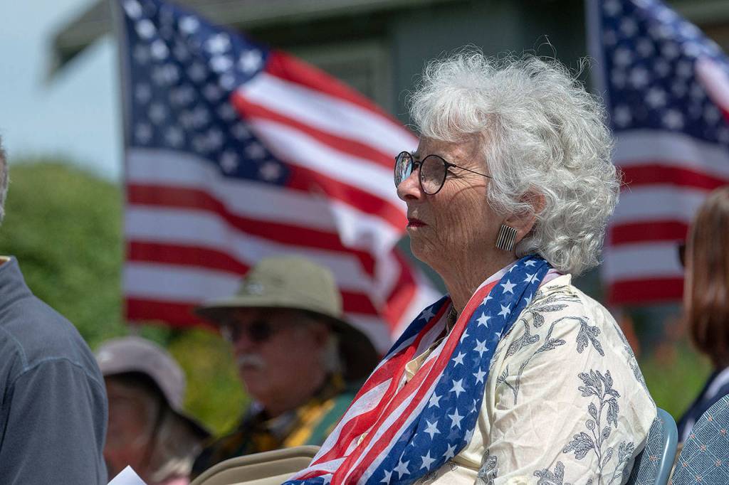 Betsy Reed Schultz, founder of Captain Joseph House, looks on during the memorial service at Captain Joseph House on Sunday. (Jesse Major/Peninsula Daily News)