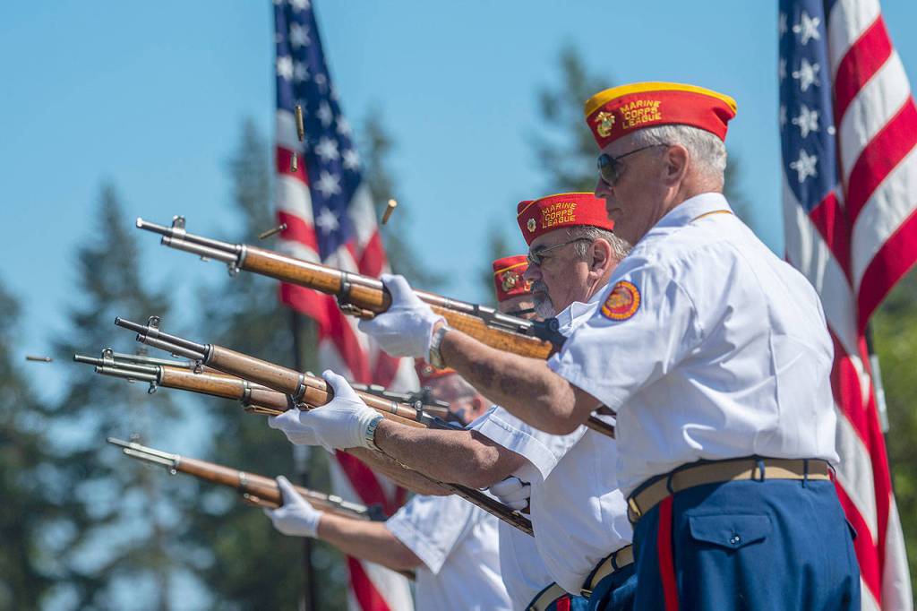 Members of the Mount Olympus Detachment of the Marine Corps League perform a rifle salute during the Memorial Day ceremony in Port Angeles on Monday. (Jesse Major/Peninsula Daily News)